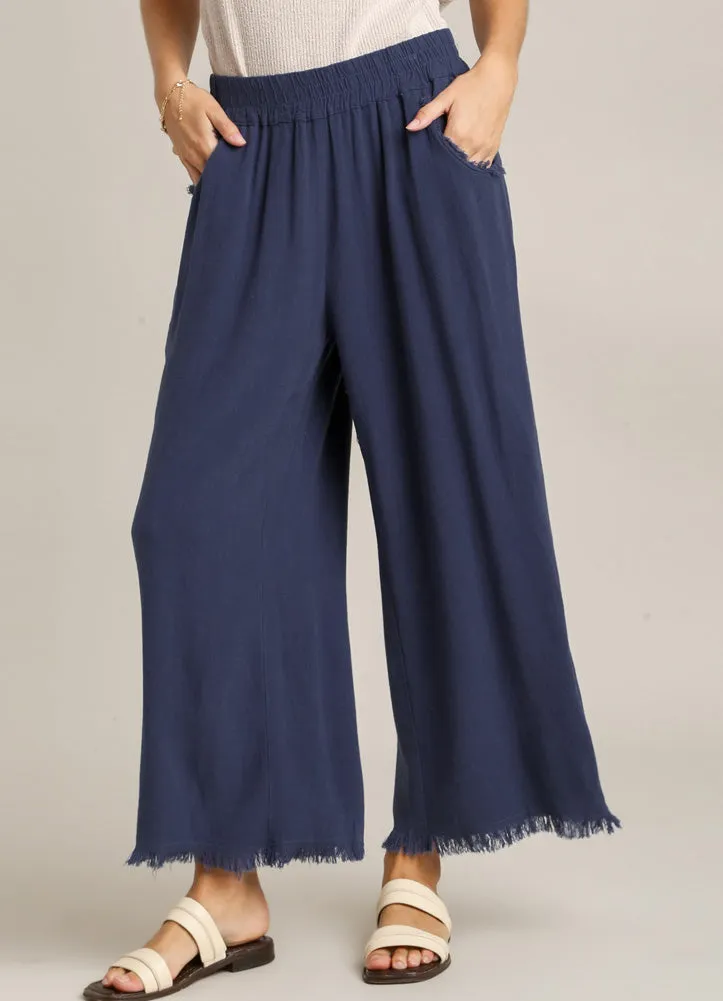 Cropped Distressed Pants in Navy by Umgee